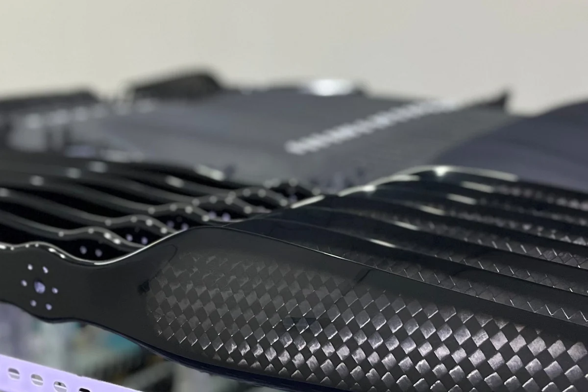 Finished carbon fiber blades showing the matte and gloss surface finishes side by side